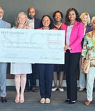 Holding check L to R: Thomas Parrish-SECU Foundation Board Member; Jama Campbell-SECU Foundation Executive Director; Tiffany Jones-UNCF Area Development Director; and Natia Walker-UNCF Development Director, surrounded by SECU leadership and local Advisory Board members.