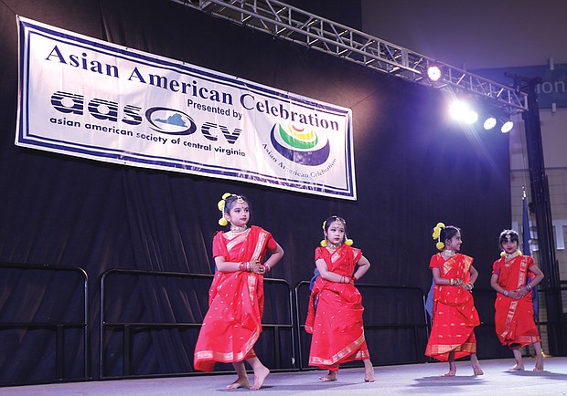 Youngsters from the local U.S. Bangladesh Social Organization perform a traditional dance during the 24th Annual Asian American Festival at the Greater Richmond Convention Center, hosted by the Asian American Society of Central Virginia last Saturday. In addition to traditional dances, the celebration included food, cultural activities and vendors.