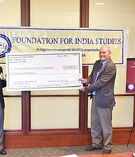 Krishna Vavilala (left), founder and chairman of the Foundation for India Studies, presents a $10,000 check to Dr. Gregory Maddox, dean of The Graduate School at Texas Southern University, for the creation of a new India Studies program at the University.