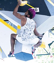 Milik Moe from Queens, New York competes in the Boulder Bash Climbing competition on Saturday.