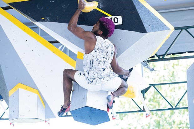 Milik Moe from Queens, New York competes in the Boulder Bash Climbing competition on Saturday.