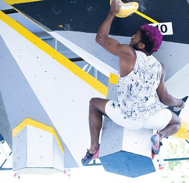 Milik Moe from Queens, New York competes in the Boulder Bash Climbing competition on Saturday.