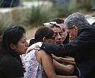 The archbishop of San Antonio, Gustavo Garcia-Siller, comforts families outside the Civic Center following a deadly school shooting at Robb Elementary School in Uvalde, Texas, on Tuesday.