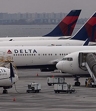 Delta Air Lines on May 26 announced it will cut about 100 flights a day from its schedule this summer to "minimize disruptions and bounce back faster when challenges occur."
Mandatory Credit:	Yuki Iwamura/AFP/Getty Images