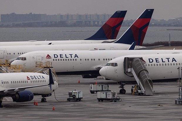 Delta Air Lines on May 26 announced it will cut about 100 flights a day from its schedule this summer to "minimize disruptions and bounce back faster when challenges occur."
Mandatory Credit:	Yuki Iwamura/AFP/Getty Images
