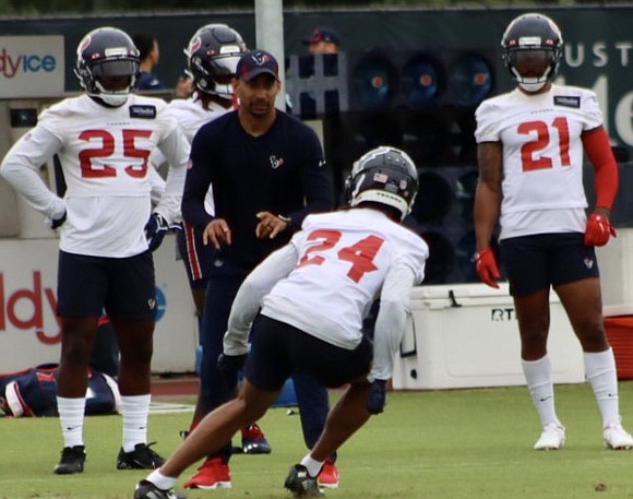 As the players for the Houston Texans began to make their way onto the field, one man was standing there …