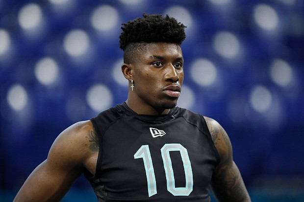 Jeff Gladney watches the 40-yard dash at the NFL football scouting combine in Indianapolis on March 1, 2020.
Mandatory Credit: Charlie Neibergall/AP