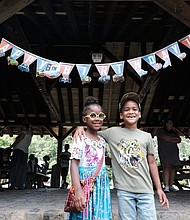 Cousins Serenity Epps, 7 left, and Amir Sanchez, 6, celebrate their birthdays during a family celebration in Forest Hill Park during the Memorial Day weekend.