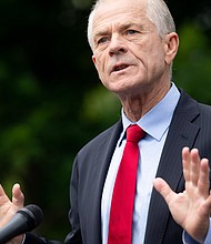Peter Navarro speaks to the press outside of the White House in June 2020.
Mandatory Credit:	SAUL LOEB/AFP/Getty Images