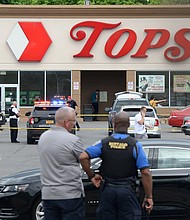 Buffalo Police on scene at a Tops Friendly Market on May 14 in Buffalo, New York. A 911 dispatcher who mishandled a call from a Buffalo supermarket manager during the fatal May shooting was fired on June 2, the Erie County Department of Personnel confirmed to CNN.
Mandatory Credit:	John Normile/Getty Images