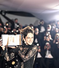 Iranian actress Zar Amir Ebrahimi poses with her trophy during a photocall after she won the best actress prize for her part in "Holy Spider" at the Cannes Film Festival in France, on May 28.
Mandatory Credit:	Loic Venance/AFP/Getty Images