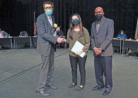 Pictured: Vice President of Administration, Martin Lareau (left) shakes hand of newly elected Student Trustee, Fatima Serrato (center), alongside Chairman of the Board of Trustees, Terry R. Wells
(right) at the South Suburban College May Board Meeting.