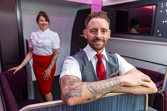 Tattooed crew members at British airline Virgin Atlantic are now welcome to show off their ink while in uniform.