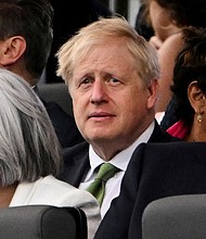 Britain's Prime Minister Boris Johnson reacts during Queen Elizabeth's Platinum Party, at Buckingham Palace, in London, Britain, June 4.
Mandatory Credit:	Paul Ellis/Pool/Reuters