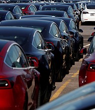 According to a tweet from its ever-mercurial CEO Elon Musk, Tesla may not be cutting staff after all, and pictured, newly manufactured Tesla electric cars in Southampton on April 20, 2020.
Mandatory Credit:	Adrian Dennis/AFP/Getty Images