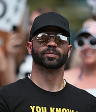 Enrique Tarrio, leader of the Proud Boys, stands outside of the Hyatt Regency where the Conservative Political Action Conference was being held on February 27, 2021, in Orlando, Florida.
Mandatory Credit:	Joe Raedle/Getty Images/FILE