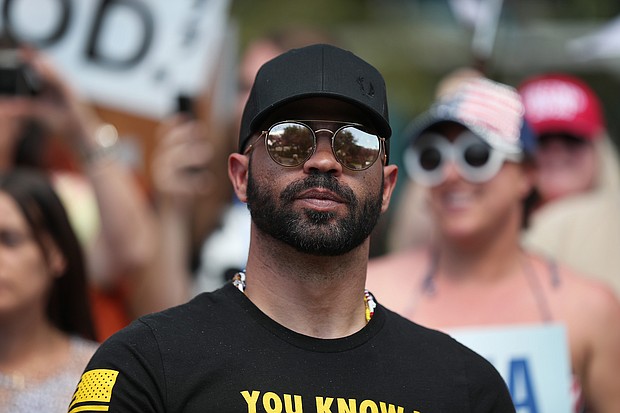 Enrique Tarrio, leader of the Proud Boys, stands outside of the Hyatt Regency where the Conservative Political Action Conference was being held on February 27, 2021, in Orlando, Florida.
Mandatory Credit:	Joe Raedle/Getty Images/FILE