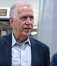Sen. Thom Tillis (R-N.C.) walks to a vote at the U.S. Capitol June 6. The two leading GOP senators involved in gun talks on Capitol Hill signaled that it's unlikely Congress will raise the age requirement for purchasing semiautomatic firearms to 21, instead saying they are looking at changing the criminal background check system to access juvenile records before a sale is complete.
Mandatory Credit:	Francis Chung/E&E News/POLITICO/AP