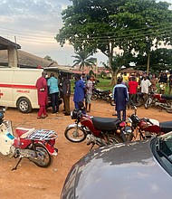 Relatives of churchgoers who were attacked by gunmen during church service gather as health workers attend to victims brought in by ambulance after the attack at St. Francis Catholic Church, in Owo, Nigeria June 5.
Mandatory Credit:	Str/Reuters