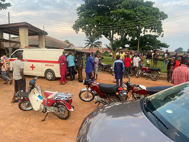 Relatives of churchgoers who were attacked by gunmen during church service gather as health workers attend to victims brought in by ambulance after the attack at St. Francis Catholic Church, in Owo, Nigeria June 5.
Mandatory Credit:	Str/Reuters