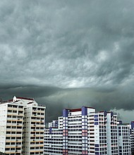 Storm clouds seen in the western part of Singapore.
Mandatory Credit:	Lionel Ng/SOPA Images/LightRocket/Getty Images