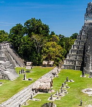 Tourists gather at the archaeological site Tikal, Guatemala. The Central American country is now at Level 2.
Mandatory Credit:	Matyas Rehak/Adobe Stock