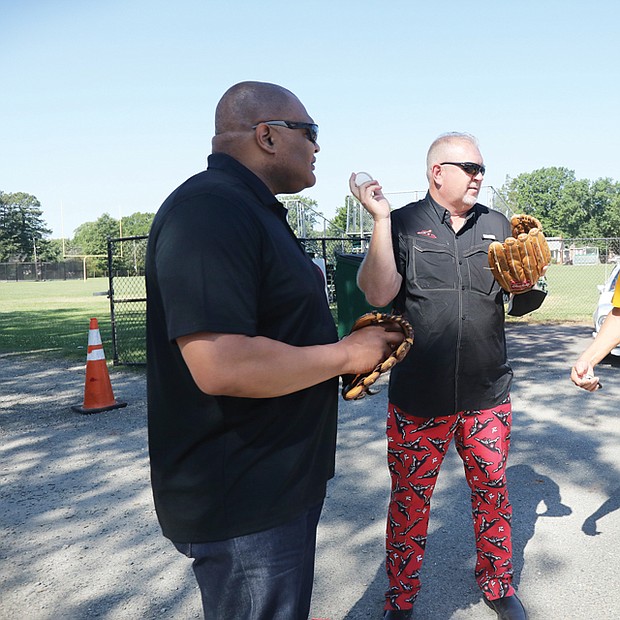 Last Saturday’s opening ceremony included Richmond Police Chief Gerald M. Smith, left, Flying Squirrels COO Todd “Parney” Parnell, center, and William Forrester Jr., MJBL executive director.
