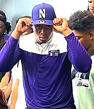 Cy-Ranch DE Ashton Porter shows off his new Northwestern Wildcats gear.