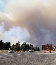 Authorities evacuated hundreds of households due to a fire in the outskirts of Flagstaff, Arizona.
Mandatory Credit:	Felicia Fonseca/AP
