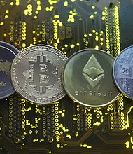Bitcoin and other cryptocurrencies pictured here, on February 14, 2018 are plunging, and two of the world's biggest cryptocurrency platforms have restricted activity as the market meltdown continues apace.
Mandatory Credit:	Dado Ruvic/Reuters
