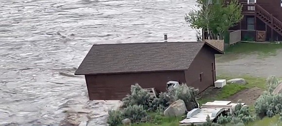 An Omaha man and his wife are stuck in Montana as floods rage in Yellowstone National Park, leaving people trapped.