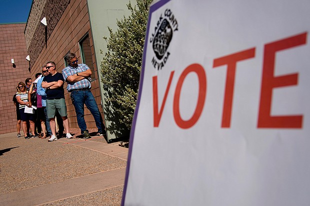 People wait in line to vote on Tuesday, June 14, in Las Vegas.
Mandatory Credit:	John Locher/AP