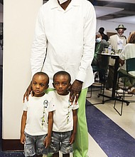 Mr. Dandridge, a Richmond native and now a Norfolk resident, stands at left, with his youngest fans, 4-year-old twins, Jru and Jre Hargrove, both of Richmond. They were attending the event with their godmother, Adrienne Milford of Richmond.