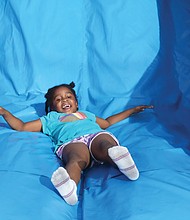 6-year-old Press Aria Moore of Henrico County enjoys the obstacle course.