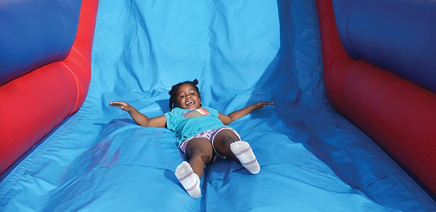 6-year-old Press Aria Moore of Henrico County enjoys the obstacle course.