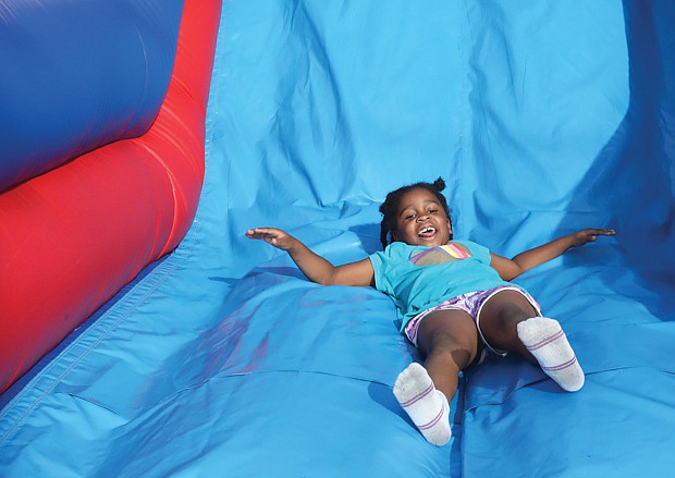 6-year-old Press Aria Moore of Henrico County enjoys the obstacle course.
