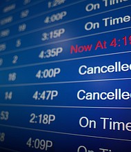 A flight information display system shows departure times at the Ronald Reagan Washington National Airport in Arlington, Virginia, on Monday, December 27.
Mandatory Credit:	Anna Moneymaker/Getty Images