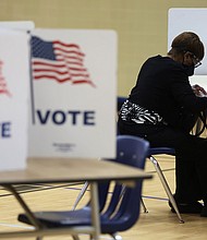 A voter casts her ballot at a polling station at Rose Hill Elementary School during the midterm primary election on June 21 in Alexandria, Virginia.
Mandatory Credit:	Alex Wong/Getty Images