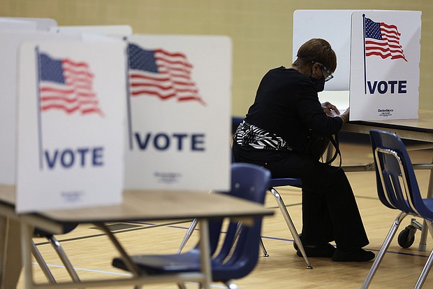 A voter casts her ballot at a polling station at Rose Hill Elementary School during the midterm primary election on June 21 in Alexandria, Virginia.
Mandatory Credit:	Alex Wong/Getty Images
