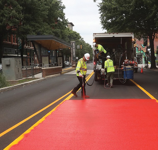 The red lane coating is the international standard for transit-only traffic, and is designed to help drivers and pedestrians be more aware of the Pulse-only lanes as well as to help buses run more smoothly.