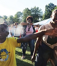 Corey Massenburg, 11, right, and his mother, Chanta Massenburg, were among enthusiastic fans on June 18 during Virginia Union University’s Hezekiah Walker Center for Gospel Music’s 2nd Annual Juneteenth Sounds of Freedom concert.