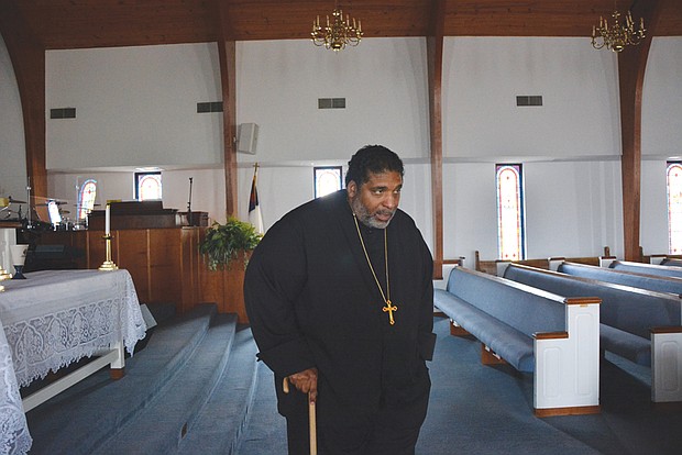 The Rev. William Barber II walks with a cane in this photo taken last March at Greenleaf Christian Church, his home congregation in Goldsboro, N.C. Rev. Barber has spoken publicly about his battle with a form of arthritis known as ankylosing spondylitis that can lead to, among other things, inflammation and fusion of the spine. Once a burgeoning football star, he moves slowly, aided by his cane and sometimes several assistants.