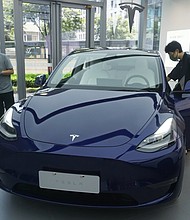 Tesla continues to face deep mistrust from officials about whether its vehicles could be used for spying, despite repeated personal assurances from CEO Elon Musk and pictured, customers purchase Tesla vehicles at a Tesla store on June 19, in Hangzhou, Zhejiang Province of China.
Mandatory Credit:	Long Wei/VCG/Getty Images
