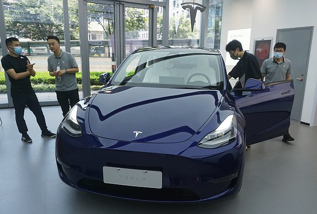 Tesla continues to face deep mistrust from officials about whether its vehicles could be used for spying, despite repeated personal assurances from CEO Elon Musk and pictured, customers purchase Tesla vehicles at a Tesla store on June 19, in Hangzhou, Zhejiang Province of China.
Mandatory Credit:	Long Wei/VCG/Getty Images