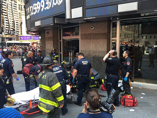 First responders attend to a person after a car was driven into pedestrians in Times Square in 2017.
Mandatory Credit:	FDNY/twitter