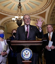 The Senate is poised to take a critical vote to advance a major bipartisan gun safety bill toward final passage, and pictured, senate Majority Leader Chuck Schumer speaks to reporters after a lunch meeting with Senate Democrats on September 28, 2021 in Washington, DC.
Mandatory Credit:	Drew Angerer/Getty Images