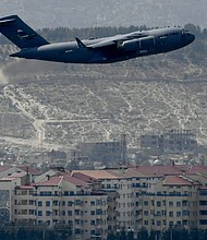 The State Department and US Agency for International Development have not provided information to a government watchdog about the fall of the Afghan government during the US withdrawal from Afghanistan last year, according to a letter from the watchdog's director, and pictured, US Air Force aircraft takes off from the airport in Kabul on August 30, 2021.
Mandatory Credit:	AAMIR QURESHI/AFP/Getty Images