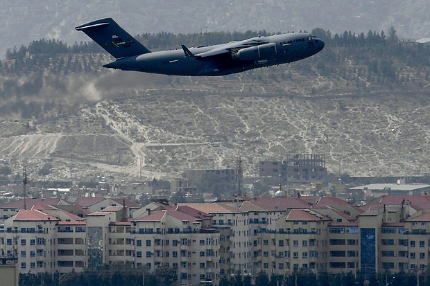 The State Department and US Agency for International Development have not provided information to a government watchdog about the fall of the Afghan government during the US withdrawal from Afghanistan last year, according to a letter from the watchdog's director, and pictured, US Air Force aircraft takes off from the airport in Kabul on August 30, 2021.
Mandatory Credit:	AAMIR QURESHI/AFP/Getty Images