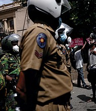 Demonstrators demand the release of protesters who were obstructing an entrance to Sri Lanka's Presidential Secretariat, amid the country's economic crisis, in Colombo on June 20.
Mandatory Credit:	Dinuka Liyanawatte/Reuters