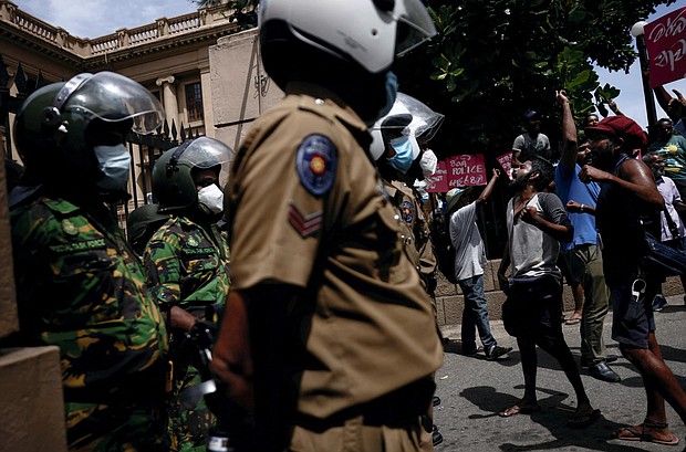 Demonstrators demand the release of protesters who were obstructing an entrance to Sri Lanka's Presidential Secretariat, amid the country's economic crisis, in Colombo on June 20.
Mandatory Credit:	Dinuka Liyanawatte/Reuters